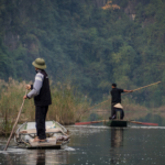 Pêcheurs dans la Baie d'Halong terrestre (Tam Coc)